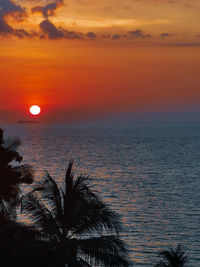 Scenic view of sea against romantic sky at sunset