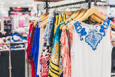 Close-up of clothes hanging on rack