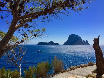 Scenic view of sea against blue sky