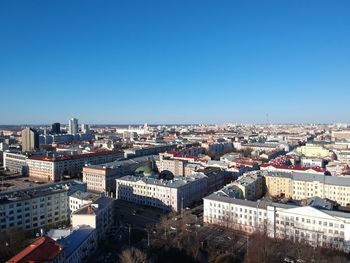 High angle view of townscape against clear blue sky