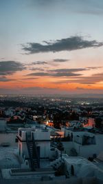 High angle view of townscape against sky during sunset