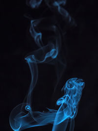 Close-up of smoke against black background