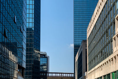 Low angle view of skyscrapers against clear sky