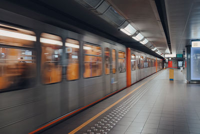 Train departing brussels metro station, belgium, motion blur.