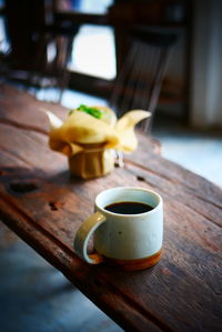 Close-up of coffee cup on table