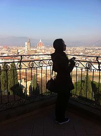 Rear view of woman standing in city