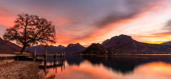 Scenic view of lake against orange sky