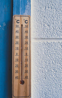 Close-up of number on table against wall