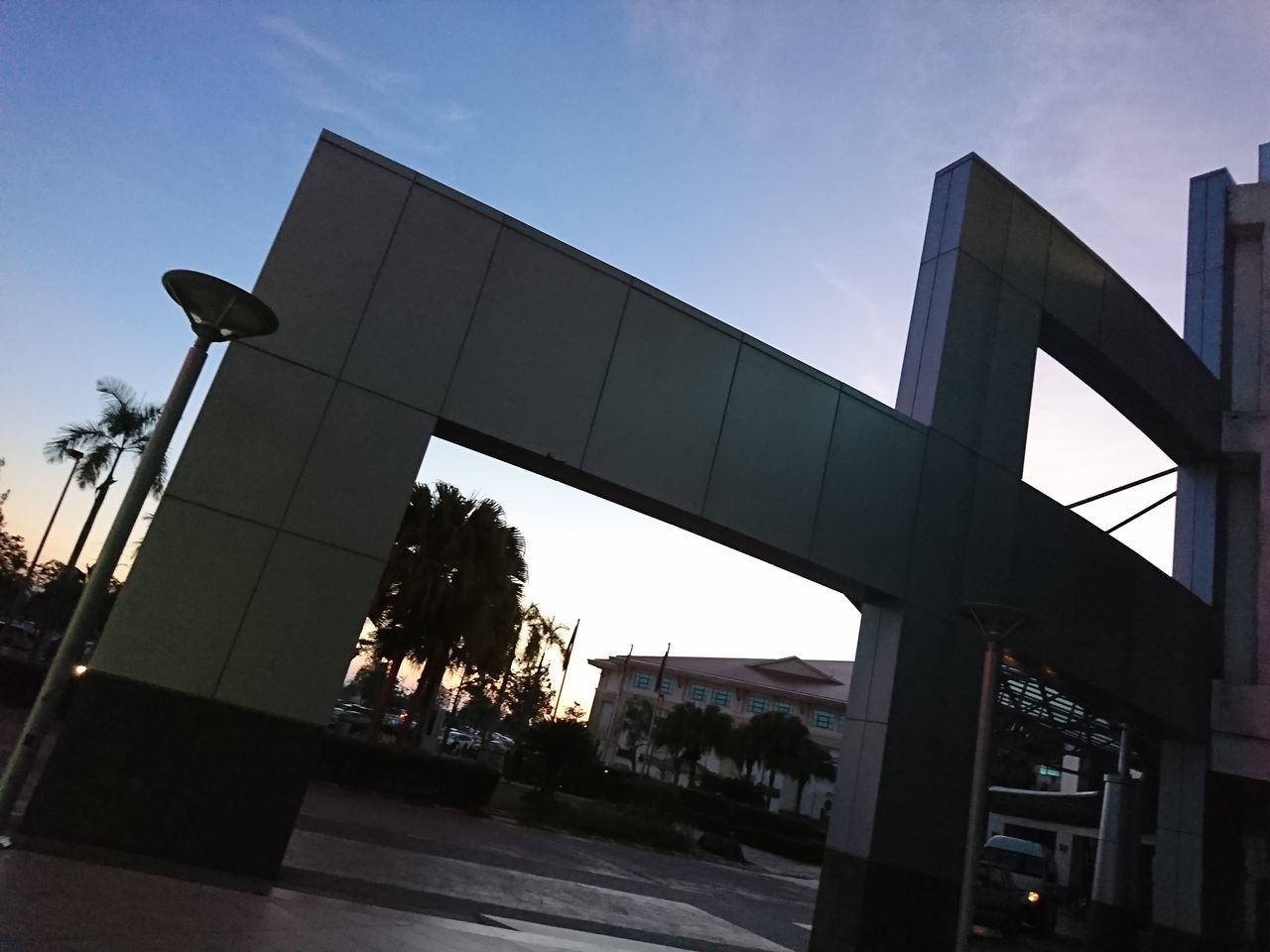 LOW ANGLE VIEW OF SILHOUETTE BUILDING AGAINST SKY