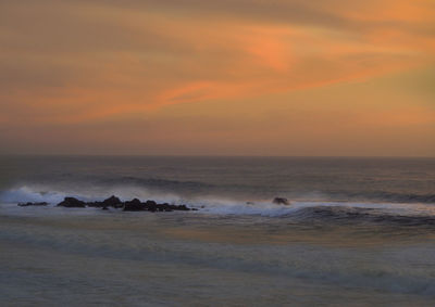 Scenic view of sea against sky during sunset