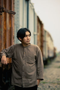 Portrait of young man standing outdoors