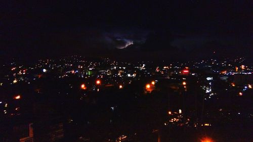 Illuminated cityscape at night