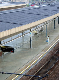 High angle view of people walking on railroad tracks