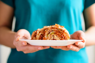 Midsection of woman holding ice cream