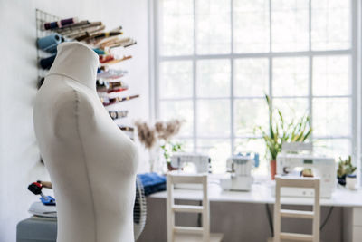 Sewing dressmaker studio small business. fashion designer working studio, with mannequin, thread