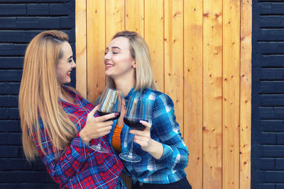 Young woman smiling while standing outdoors