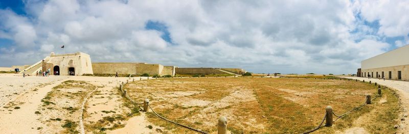 Panoramic view of old building against cloudy sky