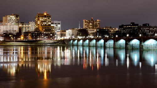 Illuminated buildings in city at night