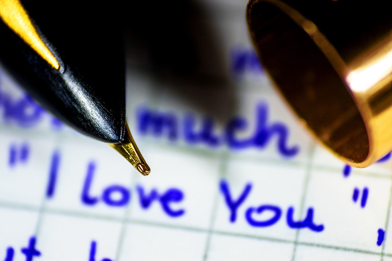 HIGH ANGLE VIEW OF PAPER AND PEN ON FLOOR