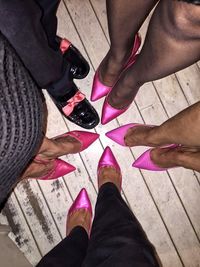 Low section of man standing on tiled floor