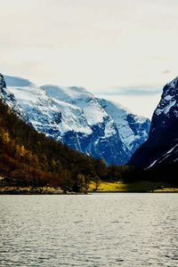 Scenic view of lake with mountains in background