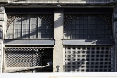 Close-up of metal grate window