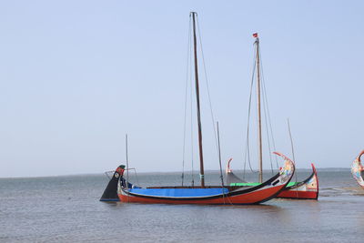 Boat in sea against clear sky