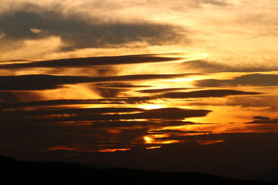 Scenic view of dramatic sky during sunset