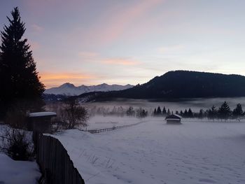 Scenic view of frozen lake against sky during winter