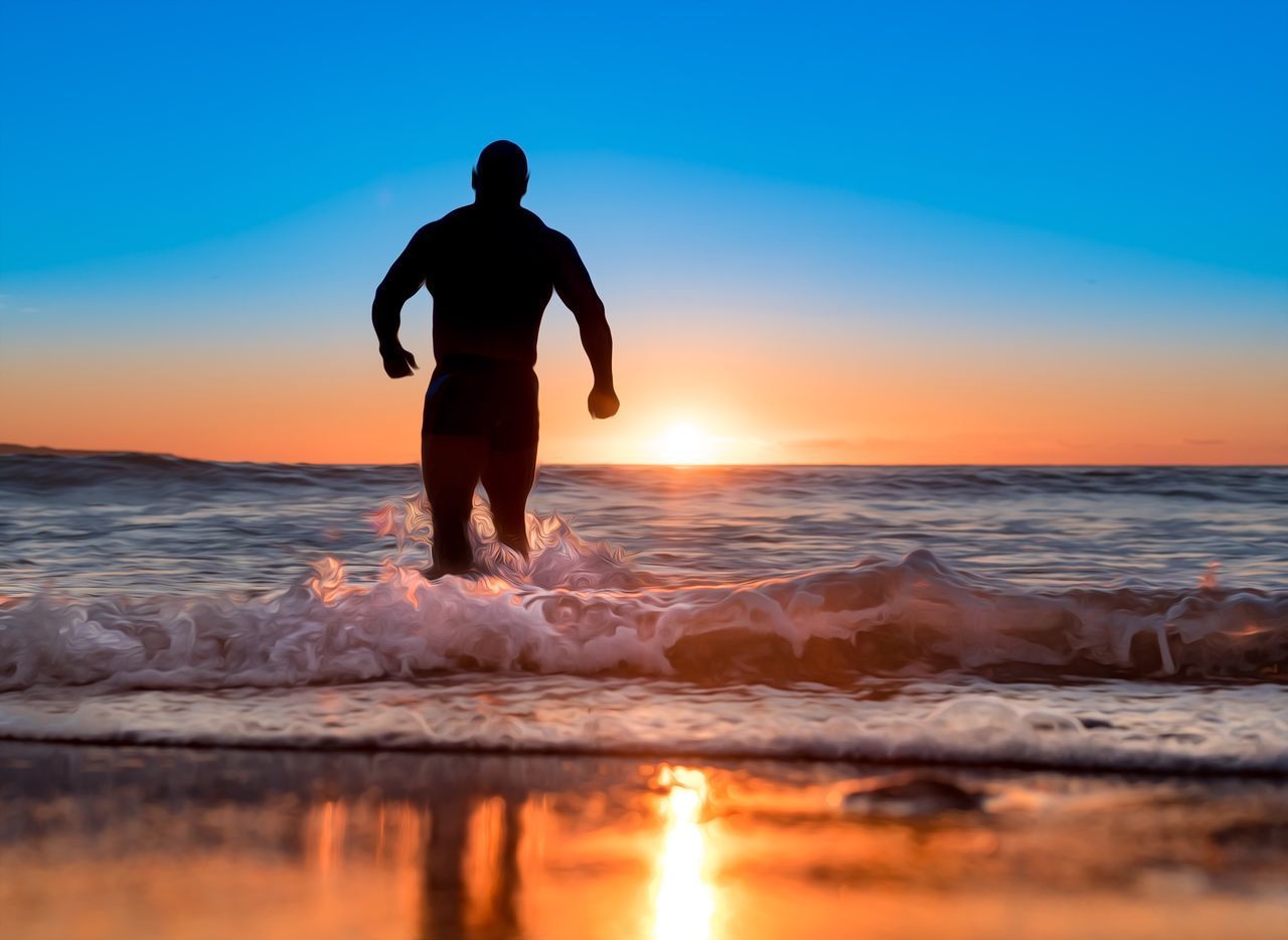 SILHOUETTE MAN AT BEACH DURING SUNSET