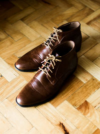 High angle view of shoes on hardwood floor