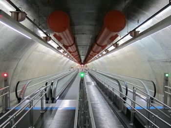Moving walkway at illuminated subway station