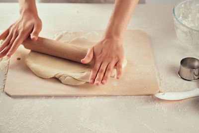 High angle view of woman preparing food on table