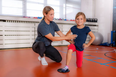 Children training with exercise gliders, improving balance and coordination skills