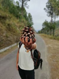 Midsection of woman standing by road