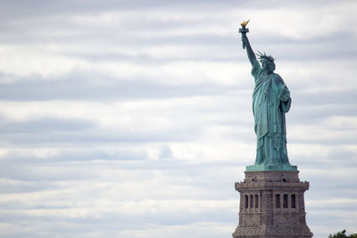 Low angle view of statue against sky