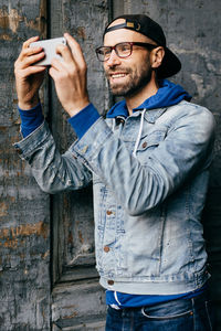 Man photographing with mobile phone