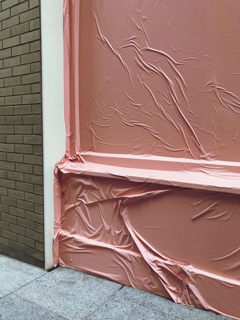 GRAFFITI ON WALL BY BUILDING