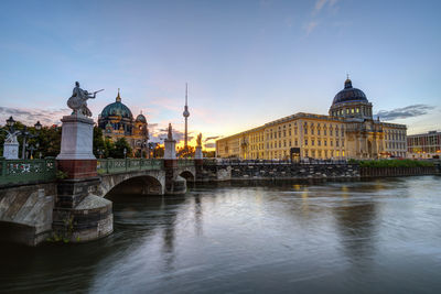 The city palace, the cathedral and the tv tower in berlin at sunrise