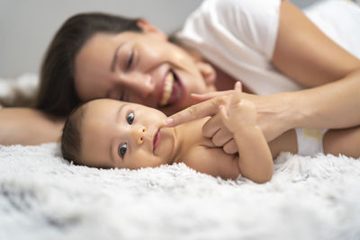 Mother playing with her baby