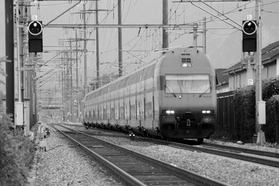 Train on railroad tracks against sky