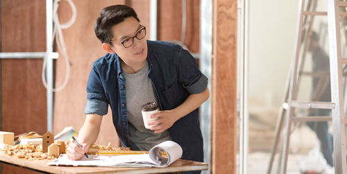 Low section of woman working on table