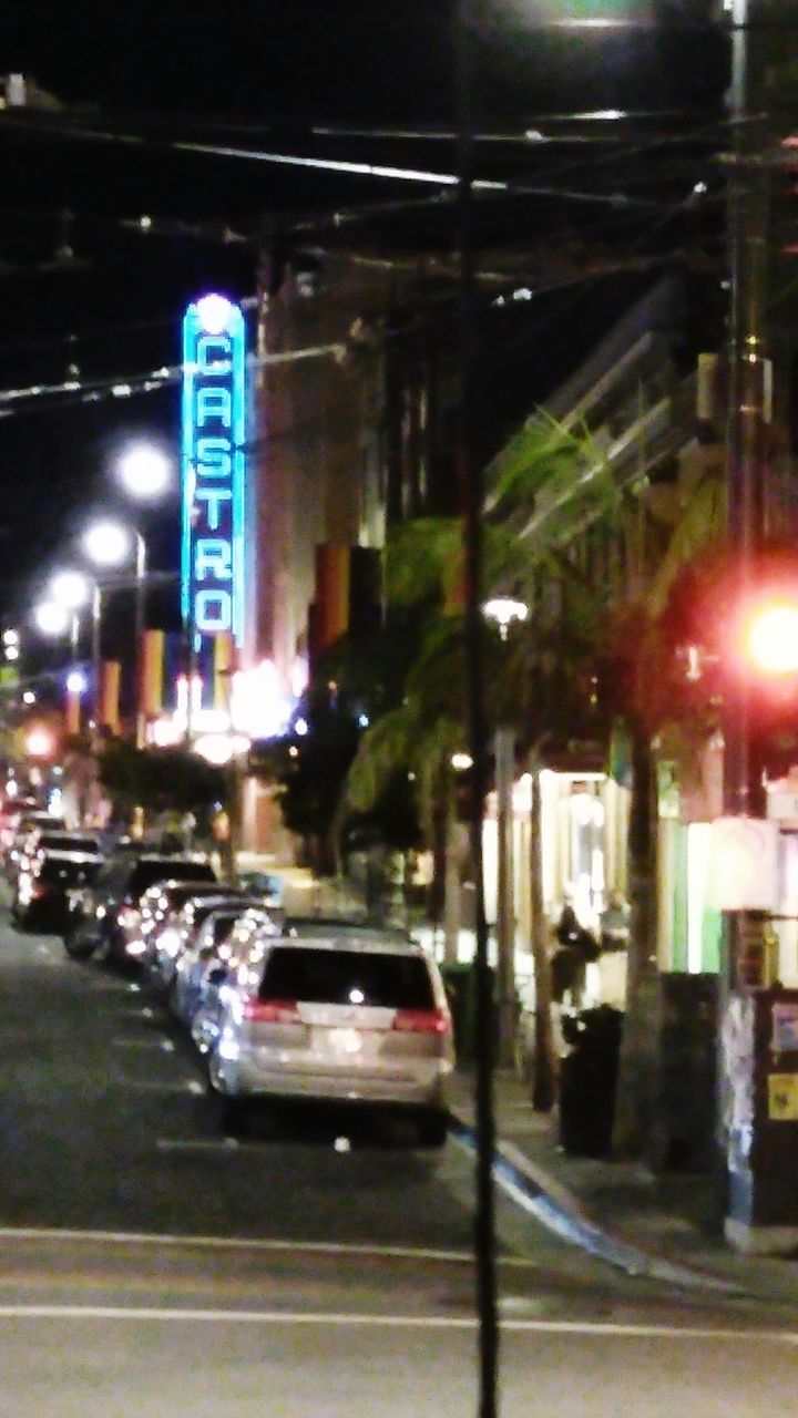 CARS ON ILLUMINATED ROAD AT NIGHT