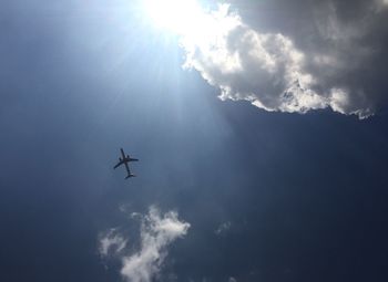 Low angle view of airplane flying in sky