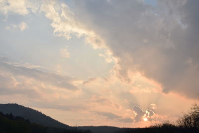 Scenic view of landscape against cloudy sky