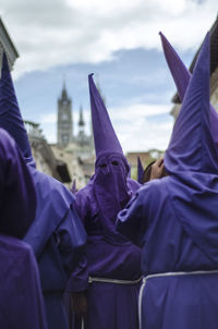 Rear view of people wearing traditional clothing during holy week celebration in spain