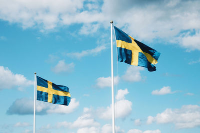 Low angle view of flag against sky