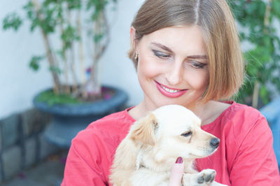 Portrait beautiful young blonde smiling and pet dog chihuahua