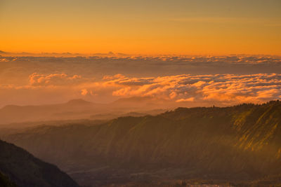 Scenic view of mountains against sky during sunset