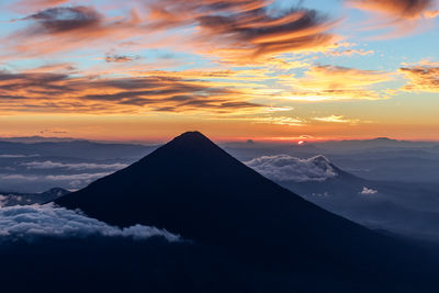 Scenic view of mountains against sky during sunset